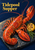 Cooked red-orange lobster arranged diagonally on a dark slate platter with charred lemon and green garnish, beneath yellow Tidepool Supper lettering.