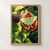Pale-green moth spread across the seeded red interior of a split fig, with leaves and another fig in warm garden light.; frame shown for styling only