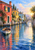 Empty wooden skiff turning through reflective canal water beside coral, ochre, and pale blue houses, with a distant arched bridge.