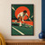 Adult male tennis player in white lunges toward a yellow ball with a racket near the court, against a red-orange circle and green field.; frame shown for styling only