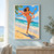 Adult woman in coral beachwear balances a halved guava while stepping on sand beside turquoise water, with a striped ball at her hip.; frame shown for styling only