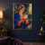 Woman in a blue cloak and patterned headscarf holding a glowing orange-gold orb in a pottery studio.; frame shown for styling only