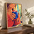 Cropped woman in coral-red knit sleeves holding a steaming blue mug near her face beside a bright window.; frame shown for styling only