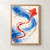 Red-orange diamond kite with a long curling ribbon tail against a cobalt-blue wash, ochre strokes, and charcoal flecks.; frame shown for styling only