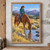 Chestnut horse drinking from a shallow stream with a teal-jacketed rider in the saddle and mountains beyond.; frame shown for styling only