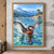 Red-crowned, russet-necked grebe splashes with wings spread on a bright alpine lake, with pines and blue mountain ridges behind.; frame shown for styling only