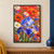 Blue-violet iris with raindrops among orange poppies, white daisies and blue flowers against a coral-red background.; frame shown for styling only