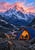 Warmly lit blue-and-orange tent on a rocky alpine shelf beneath a rose-and-coral dawn sky and jagged snowy peak.