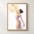 Adult woman in a dance outfit stretching one arm overhead in front of a pale apricot circle on a white background.; frame shown for styling only