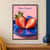 Lengthwise-split strawberry with leafy cap on a cobalt-blue plate against a soft pink background.; frame shown for styling only