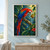 Scarlet-and-blue macaw perched on a diagonal branch, leaning toward a hanging seed pod among tropical leaves.; frame shown for styling only