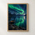 Green aurora reflected in a dark mountain lake, with snow-dusted peaks and a small lantern-lit rowboat at the rocky shore.; frame shown for styling only