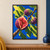 A split fig with a crimson, seed-filled center and two whole figs among green leaves on a diagonal branch against vivid blue.; frame shown for styling only