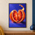 Two upright blood orange halves with vivid red-orange segments, droplets, and a curling peel against a blue-violet background.; frame shown for styling only