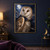 A tawny barn owl with amber eyes wears a dark blue-black cape and medallion against a moonlit cloudy sky.; frame shown for styling only