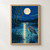 Great blue heron wading in blue moonlit water beneath a full moon, framed by reeds and willow branches.; frame shown for styling only