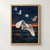 Five white herons fly above dark marsh reeds and reflective water beneath a narrow orange-apricot sunset.; frame shown for styling only