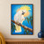 A white cockatoo with a raised yellow crest reaches toward eucalyptus leaves from a diagonal branch against a blue background.; frame shown for styling only
