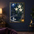 White jasmine blossoms and glossy leaves surround a stone fountain beneath a blue tiled arch, with a moon, floating flower and lantern.; frame shown for styling only