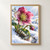 Pink-magenta hellebore with green leaves and a drooping bud growing amid snow above a reflective meltwater pool.; frame shown for styling only