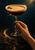 A hand grips the stem of a clear coupe filled with dark mocha and pale foam topped with three coffee beans, against a dark teal background.