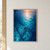 Overhead view of a small swimmer in a coral cap moving through blue water toward a warm reflected sky.; frame shown for styling only