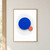 Large ultramarine circle touching a smaller coral disk, surrounded by fine curved charcoal lines on white.; frame shown for styling only