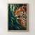 Orange-and-ivory tiger in left-facing profile emerging through green bamboo, with an amber eye and deep navy shadows.; frame shown for styling only