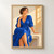 A woman in a cobalt wrap dress sits on a pale bench and turns toward warm window-grid light.; frame shown for styling only