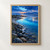 Turquoise lagoon bordered by wet stones at blue hour, with distant hills, small white birds, and a peach-lit horizon.; frame shown for styling only