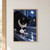 Black-and-white tuxedo cat reaching toward a folded paper boat in a puddle on a rainy, moonlit windowsill.; frame shown for styling only