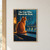 A ginger cat sits on a wide sill facing a rain-streaked window, with its face reflected beside a bright branching raindrop.; frame shown for styling only