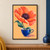 A large coral-orange poppy grows above a cobalt teacup against an apricot ground, with green leaves and floating flecks.; frame shown for styling only