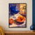 Cobalt-blue teapot pouring amber tea into an amber cup on a coral saucer, with a sliced blood orange, green leaf, striped cloth, and warm window light.; frame shown for styling only