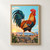 Vivid rooster striding across a rough stone wall at sunrise, with rooftops, trees, and hills in the distance.; frame shown for styling only