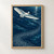 White heron gliding over a curved school of silver fish in deep blue moonlit water, with a pale moon in the upper-right sky.; frame shown for styling only
