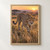 Forward-facing spotted cheetah with one forepaw lifted amid golden grass in a softly blurred sunrise savanna.; frame shown for styling only