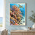 Sea turtle swimming above branching coral, clownfish among anemone tentacles and blue fish in bright turquoise water.; frame shown for styling only