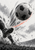 Black-and-white football above a cropped player's boot, with brush-like motion streaks, grass, a stadium light, and a coral arc.