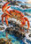 Red-orange crab with one raised claw on dark wet rocks amid turquoise surf and white foam.
