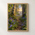 A woodland path winds between white-barked birch trees and blue-violet flowers toward a golden sunrise.; frame shown for styling only