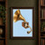 A brass flared horn connects diagonally to a cutaway wooden box with a visible membrane and curved tube on a pale-blue background.; frame shown for styling only