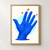 Cobalt-blue open hand with spread fingers against a pale cyan circle, accented by three orange starbursts and a navy shadow.; frame shown for styling only