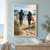 Two people carrying surfboards walk down a sandy path framed by dune grass toward a bright sea and breaking wave.; frame shown for styling only