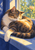 Multicolored house cat asleep curled on a blue windowsill, one pale paw draped over the sill, with green foliage outside.