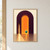 Dark plum arch with a glowing orange opening, hovering turquoise sphere, and golden beam reflected across an ivory floor.; frame shown for styling only