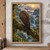 A pale-headed eagle looks back from a moss-covered branch above a misty rainforest ravine and waterfall at dawn.; frame shown for styling only