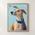Fawn-colored, whippet-like dog with amber eyes and cobalt collar looking up at a moth against a pale aqua background.; frame shown for styling only