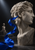 Pale faceted stone head in profile with a hand cupped at its ear, a curling cobalt ribbon, and a small distant bust.