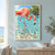 Pink-orange flamingo wading toward a small fish in turquoise water, with reflections and distant mangroves.; frame shown for styling only